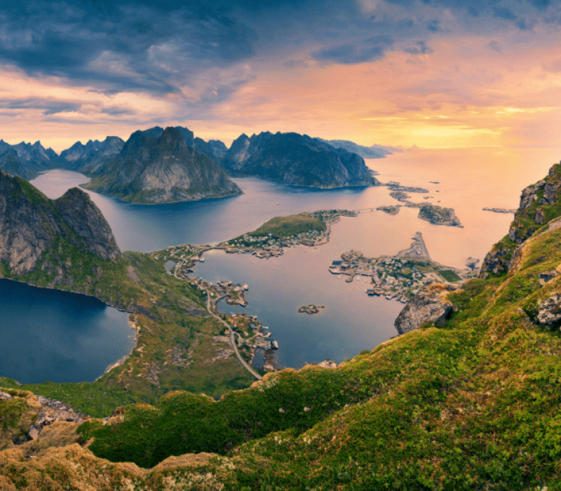 Stunning aerial view of Lofoten Islands at sunset – the natural backdrop for exclusive Nordic culinary experiences and luxury chef services from Norway.